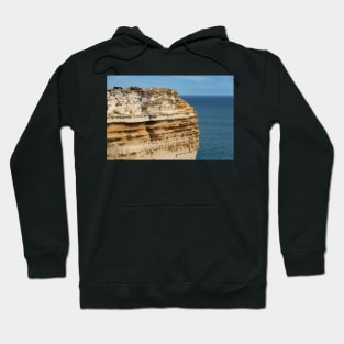 Layered limestone cliff at Loch Ard Gorge, Australia. Hoodie